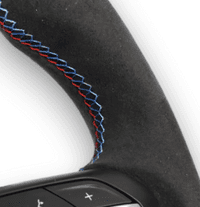 Premium steering wheel grip materials including Alcantara and leather